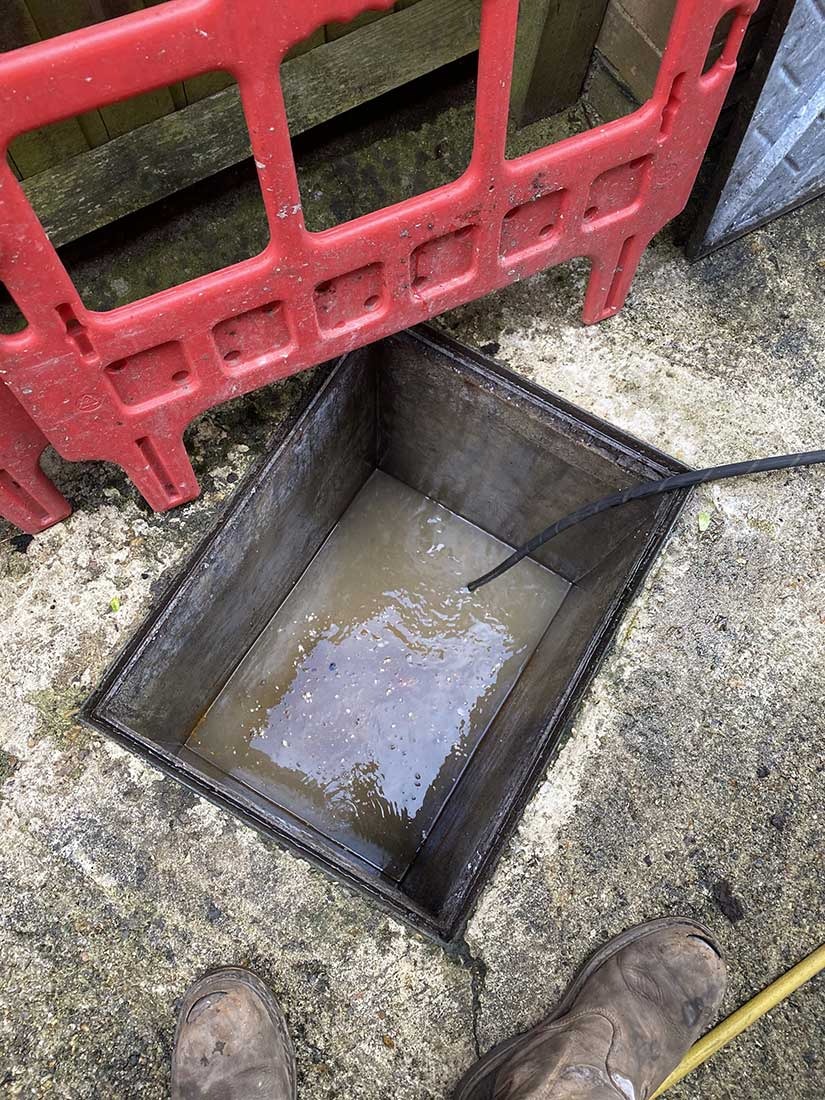 High-pressure jetting clearing a blocked manhole on a Berkshire drainage callout